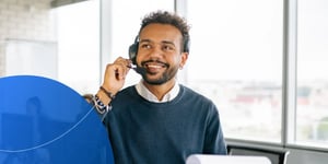 Man wearing a headset smiling 