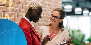 A woman selling to another woman having a conversation