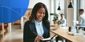 A business woman taking note on the notebook at office