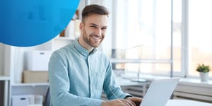 Man sitting at desk with laptop 