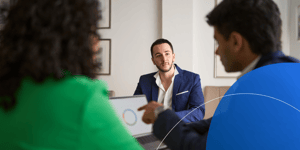 L&D managers discussing top AI coaching programs at the meeting room